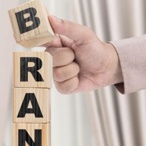 business-hand-put-wooden-cube-stack-with-brand-text_9083-23324-min