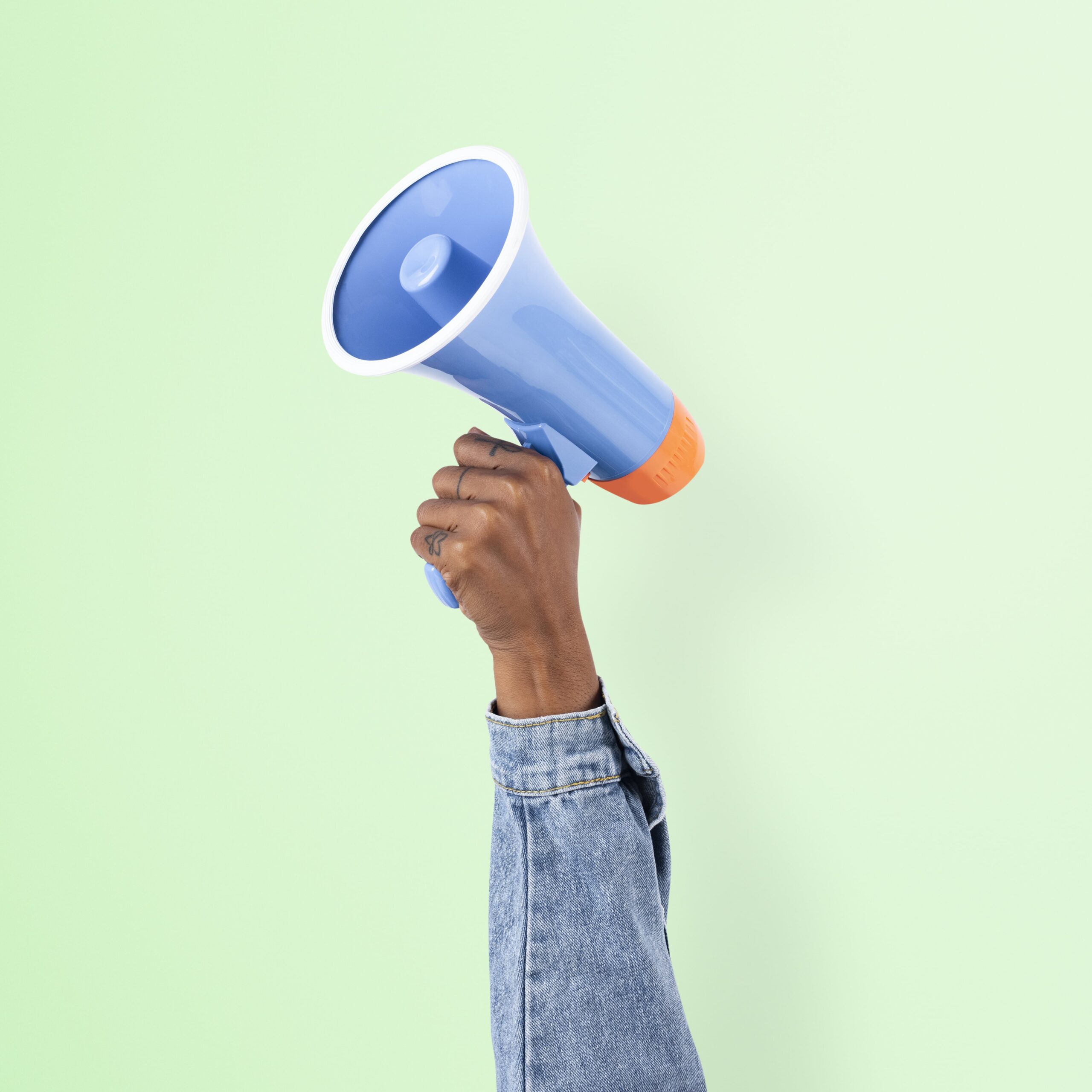 hand-holding-megaphone-marketing-announcement-campaign-min