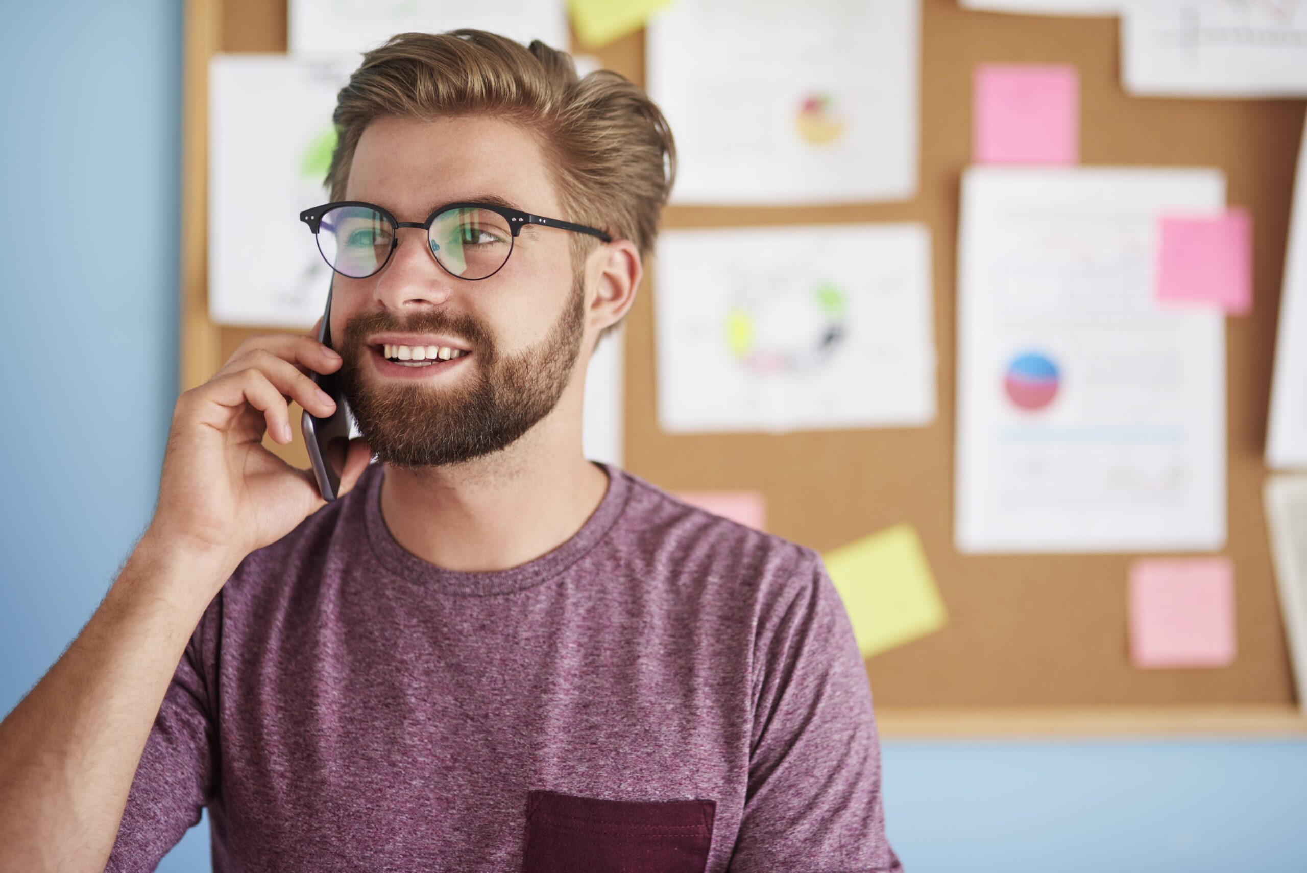 busy-man-talks-phone-min